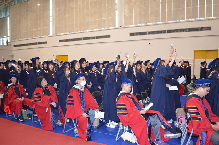 Behind-the-scenes moments from the graduation ceremony.(Open new window/jpg file)Image