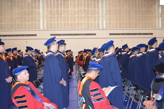 Behind-the-scenes moments from the graduation ceremony.(Open new window/jpg file)Image